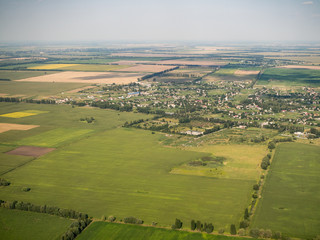 Fototapeta na wymiar Aerial farming lands patchwork view