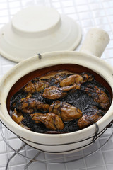 braised dried oysters with black moss (ho see fat choy ) in pot, traditional chinese new year dish