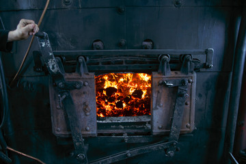 Burning coal in the open furnace of a steam locomotive