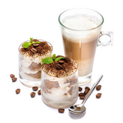 Classic tiramisu dessert in a glass and cup of coffee isolated on a white