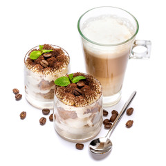 Classic tiramisu dessert in a glass and cup of coffee isolated on a white