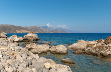Fototapeta na wymiar Huge stones at coast of Crete island, Grece