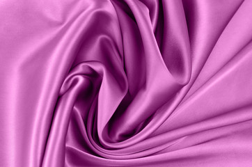 Background from satin fabric of pink color.