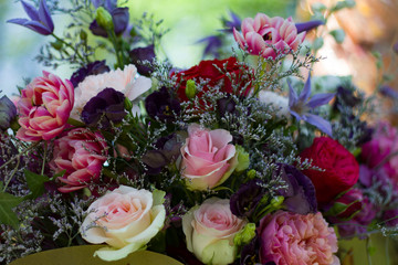 a bouquet of red white flowers of red and pink roses