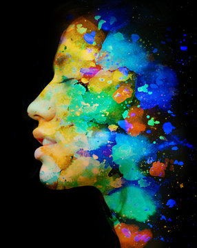 Paintography. Double exposure. Close up of an attractive peaceful model combined with colorful hand drawn painting