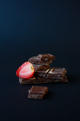croissant with strawberry on black background
