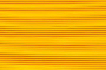 Surface texture in the form of parallel lines on a yellow background