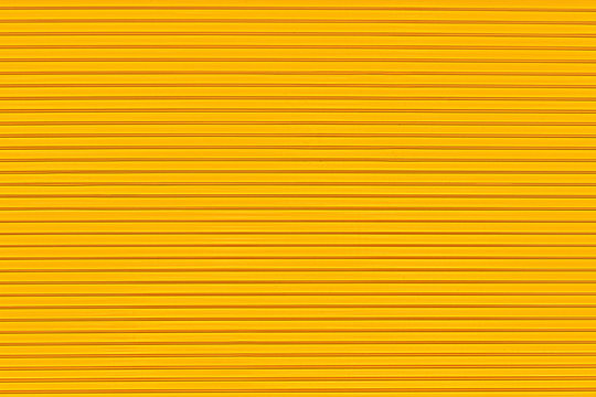 Surface texture in the form of parallel lines on a yellow background