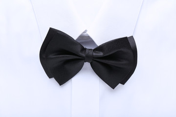 White shirt with black bow tie