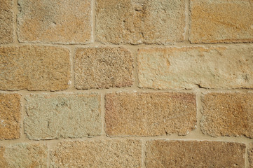 Close-up of wall with small gravel inserted into the plaster at Caceres
