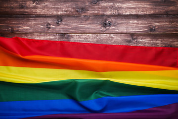 Rainbow flag on brown wooden table
