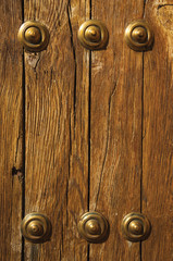 Bronze studs attached to wooden planks at Caceres