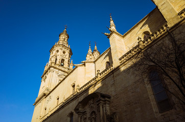 Fototapeta na wymiar Logroño, La Rioja, Spain - February, 15th, 2019 : South facade of the Co-Cathedral of Santa María de la Redonda along Calle Portales street.