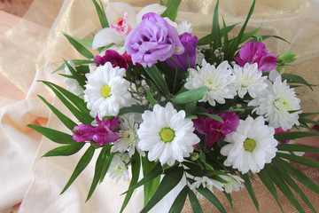 bouquet of flowers on silk background