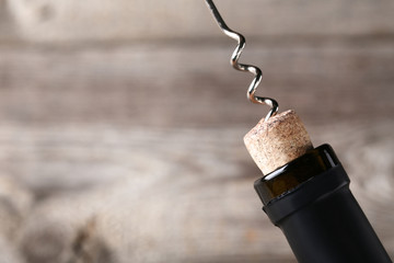 Wine bottle with cork and corkscrew