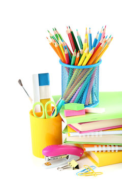 School supplies with books and notebooks on white background