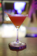 Soft focus photo of Brown Derby Cocktail. Image with shallow depth of field and contains a little noise due to poor lighting conditions.