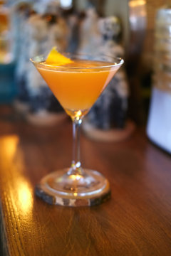 Soft focus photo of Brown Derby Cocktail. Image with shallow depth of field and contains a little noise due to poor lighting conditions.