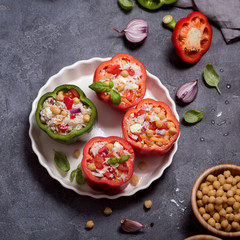 Stuffed vegetarian peppers or paprika with rice and chickpeas, vegan cooking, healthy summer lunch