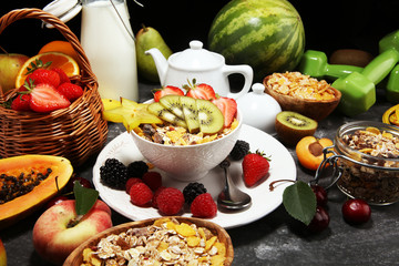 Healthy breakfast. Bowl of yogurt with granola and berries, fresh fruits and smootihies