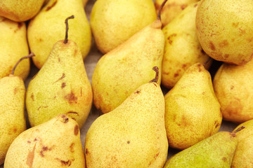 A large group of yellow pears close-up