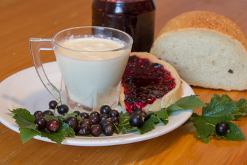 breakfast on the table milk with bread,On the table, milk with bread made from black currant for breakfast