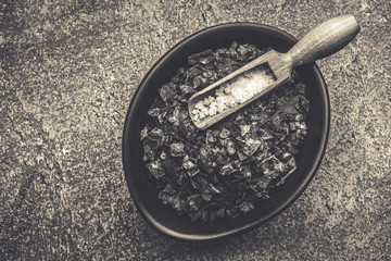 Black Salt Crystals on Dark Texture Background