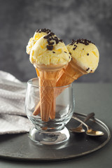 Ice cream cones in glass jar. Summer foods, vanilla ice cream dessert.