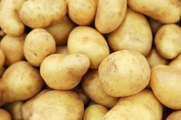 Raw potatoes closeup group