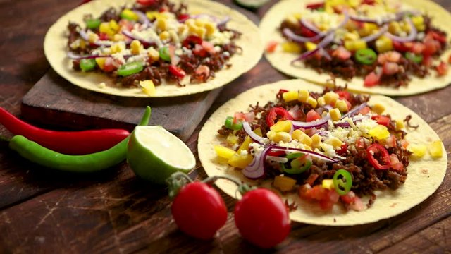 Healthy corn tortillas with grilled beef, fresh hot peppers, cheese, tomatoes