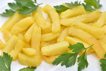 Street food. A dish of sausages and fried potatoes.