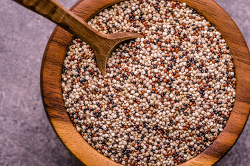 Organic Quinoa Grains in Rustic Wooden Bowl