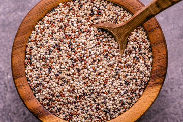 Organic Quinoa Grains in Rustic Wooden Bowl