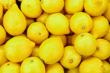 Citrus yellow fresh lemon close-up by group