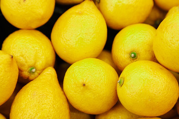 Citrus yellow fresh lemon close-up by group