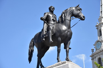 Fototapeta na wymiar King George IV (1762-1830) statue on Trafalgar Square, London, England. George the Fourth was King of England, Scotland and Ireland