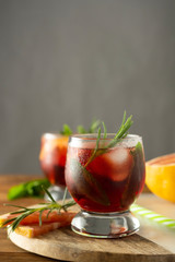 Summer drink. Fruit refreshing cold cocktail. Wooden table.