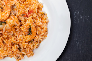 traditional portuguese dish rice with seafood in white dish
