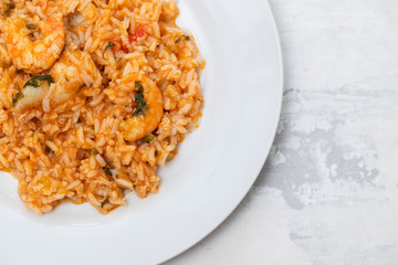 traditional portuguese dish rice with seafood in white dish