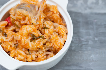 traditional portuguese dish rice with seafood in white dish