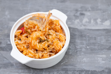 traditional portuguese dish rice with seafood in white dish