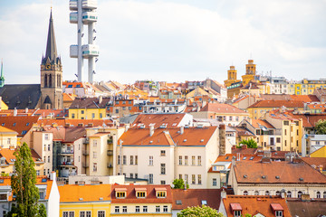 Obraz premium View from the top of the Vitkov Memorial on the Prague landscape on a sunny day with the famous Zizkov TV tower on the horizon