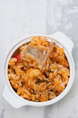 traditional portuguese dish rice with seafood in white dish