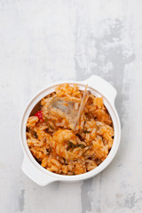 traditional portuguese dish rice with seafood in white dish