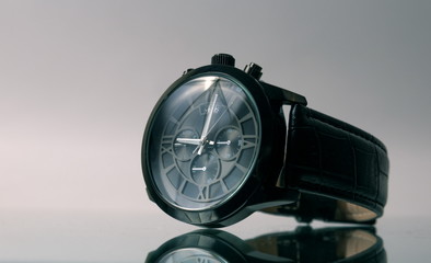 Elegant wrist watch closeup on dark