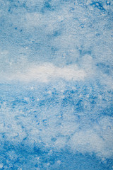 blue watercolor paint stain on textured background