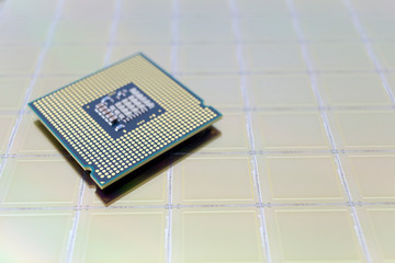 Photo of a Computer Chip CPU put on silicon wafer with microchip