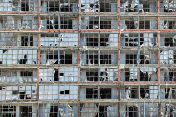 Abandoned office building wall texture. Skeleton of abandoned apartment building. Architecture background of building walls.