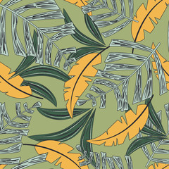 Seamless pattern with yellow tropical flowers on a green background. Vector design. Jungle print. Floral background.