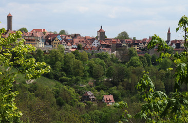Fototapeta na wymiar Rothenburg ob der Tauber across the valley and through the trees